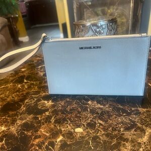 Gently used Michael Kors Clutch. Perfect for the Lady on the go!